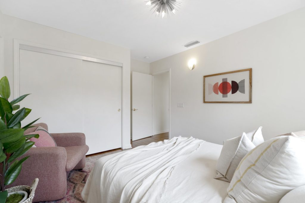 white room with white comforter